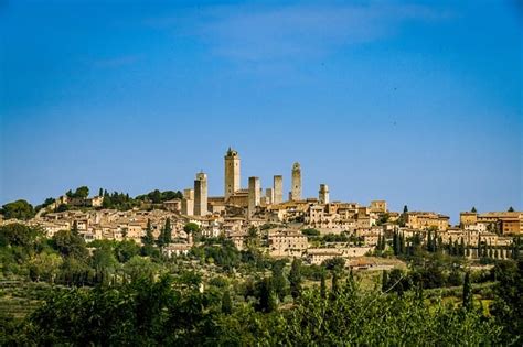why you ll never forget the 14 soaring san gimignano towers of tuscany