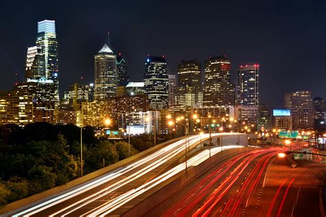 Philadelphia Skyline At Night In Color Car Light Trails Photograph By