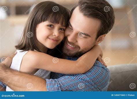 Loving Dad And Daughter Hug At Home Making Picture Stock Image Image