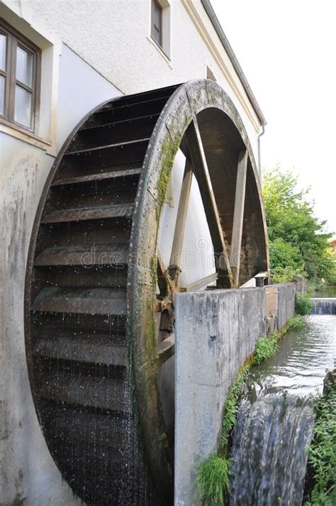 Rusty Iron Wheel Of Old Mill Waterwater Wheel Motion Blur On Wheel