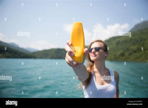 Sunscreen Woman Applying Suntan Lotion Showing Bottle Beautiful Smiling Happy Caucasian Woman