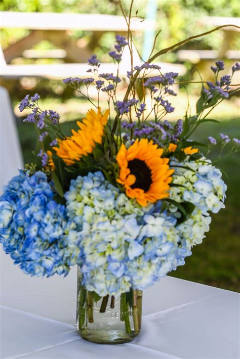 Blue Hydrangea And Sunflower Centerpieces