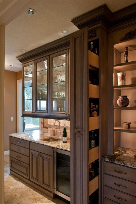 We offer ready to assemble kitchen cabinetry in over 41 door styles. hidden liquor cabinet Kitchen Traditional with award ...