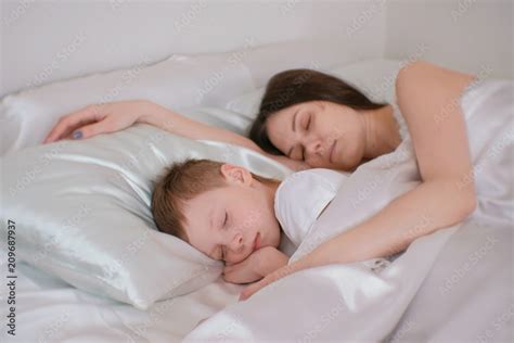 Mom And Son Sleeping Together Mom Hugging Her Son Stock Photo Adobe Stock