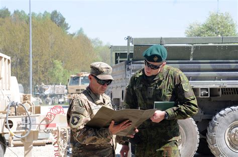 Us Lithuanian Soldiers Stand Shoulder To Shoulder For Combined Resolve