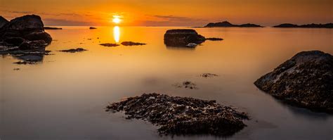 Download Wallpaper 2560x1080 Sunset Sea Rocks Horizon Dual Wide