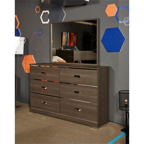 The simple, functional design features a lacquer finish and solid maple and white medium density fiberboard construction. B132-21 Ashley Furniture Annikus Kids Room Dresser