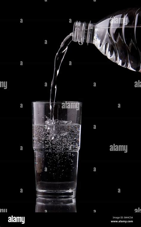 Close Up Of Water Being Poured Into Glass From Water Stock Photo Alamy