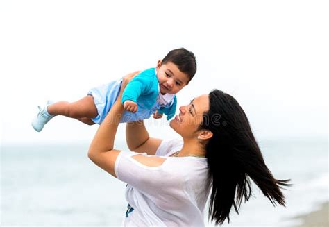 Young Mother With Her Baby On The Beach Stock Photo Image Of