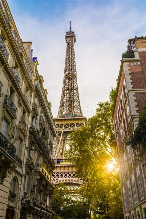 Low Angle View From An Adjacent Street Over The Eiffel Tower In Paris