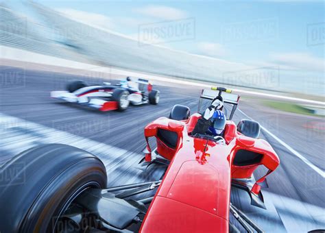 Formula One Race Car Crossing Finish Line On Sports Track Stock Photo