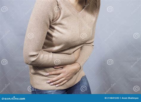 Girl Holding Her Stomach In Pain Stock Image Image Of Abdominal Spasm 214841245