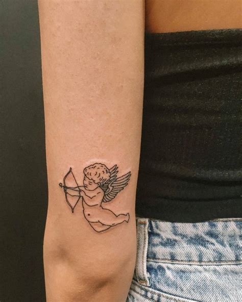Cupid Tattoo Located On The Tricep