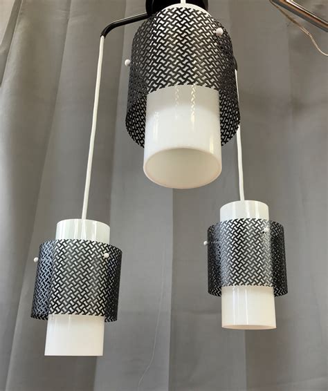 These differ not only in their appearance, but. Mid-Century Modern Triple Pendant Ceiling Light Fixture ...