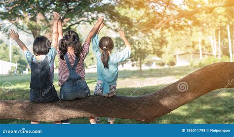 Children Friendship Concept With Happy Girl Kids In The Park Having Fun