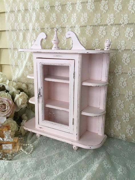 Two wooden platforms with a mirrored back. Shabby Chic pink hanging Curio Cabinet with glass door ...
