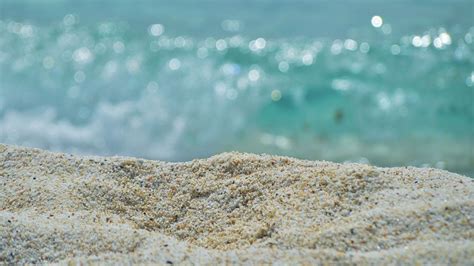 beach sand in blue white bokeh background hd sand wallpapers hd wallpapers id 72365