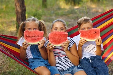 Premium Photo Children Eat Watermelon And Joke In The Fresh Air