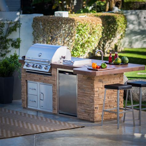A place to store what you need for cooking or more often a great place to keep your beverages cool and ready for entertaining. Bull BBQ Grill Island - Outdoor Kitchens at Hayneedle