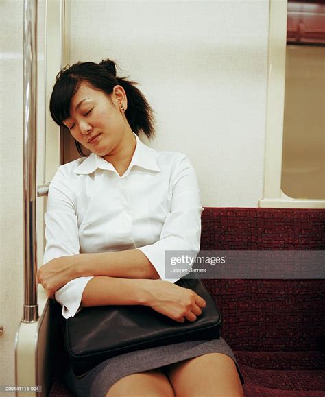 Young Businesswoman Sleeping In Subway Train Photo Getty Images
