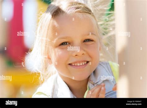Happy Little Girl Climbing On Children Playground Stock Photo Alamy