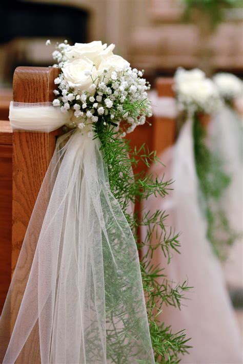 Your wedding ceremony decorations can serve as a way to guide and welcome guests. Ivory Rose and Baby's Breath Ceremony Aisle Decor