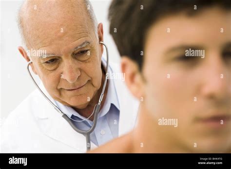 Doctor Conducting Medical Exam Stock Photo Alamy