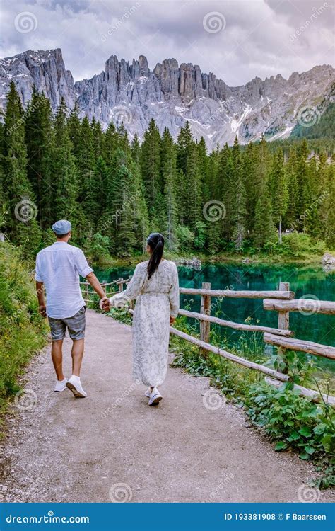 Couple Visit Hte Bleu Lake In The Dolomites Italy Carezza Lake Lago Di