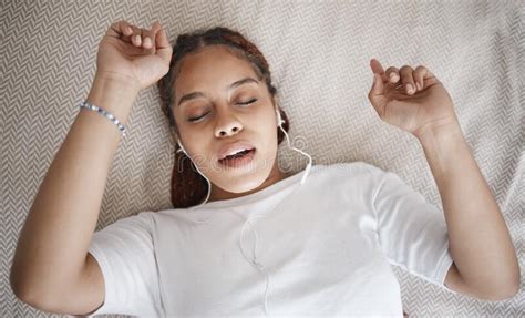 Relax Sleep And Bed With Woman Listening To Music While Sleeping In