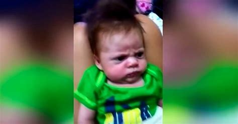 Angry Baby Refuses To Smile Despite Parents Numerous Attempts To Cheer