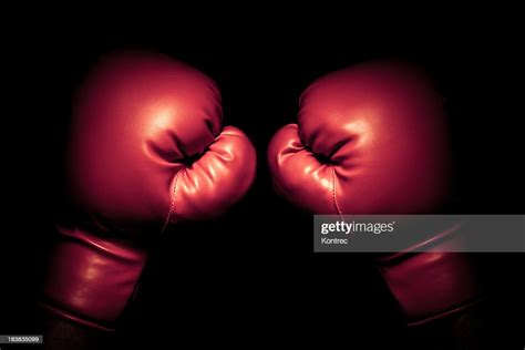 Vintage Boxing Gloves Emerging From Black Background High Res Stock