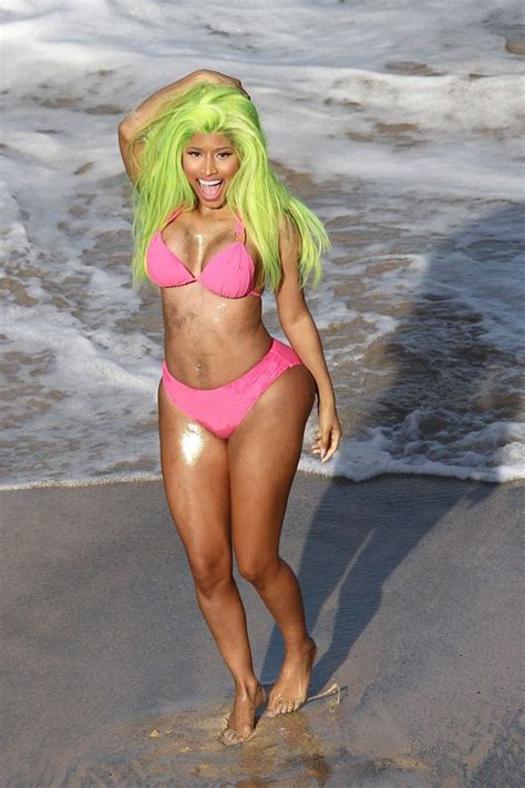 Nicki Minaj Wearing A Pink Bikini And Green Wig In The Video For Starships Mirror Online