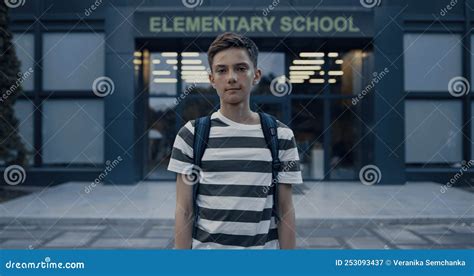 Closeup Serious Teen Boy Standing At Schoolyard Tensed Schoolboy
