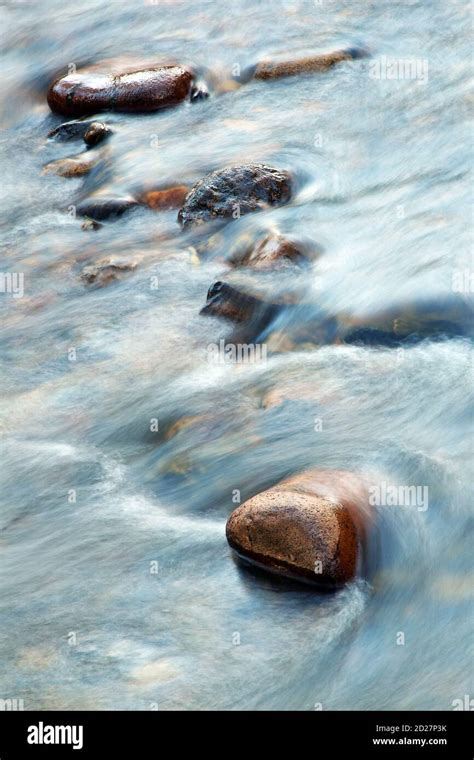 Water Flowing Over Rocks In A Small Creek Stock Photo Alamy