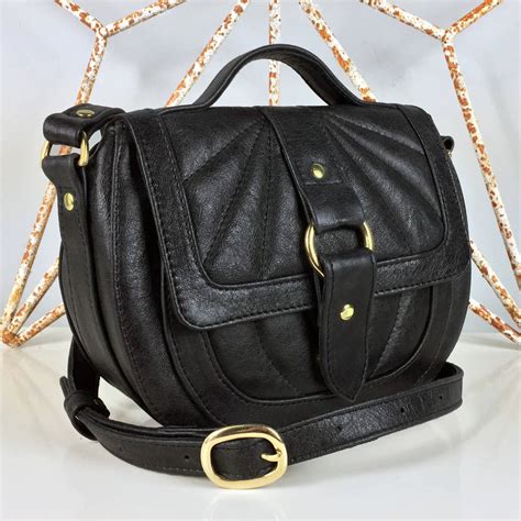 Our versatile, convertible leather crossbody bags, small crossbody purses (we call them dinkys), and collectable crossbody bags for women are ready to go anywhere with you. quilted black saddle bag by freeload accessories ...