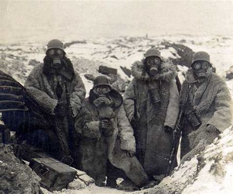 Four German Soldiers Wearing Fur Coats And Gas Masks In A Trench 1917