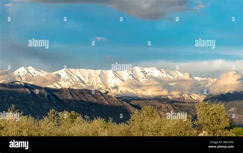 Panorama Scenic Nature View With Majestic Snow Peaked Mountain Under