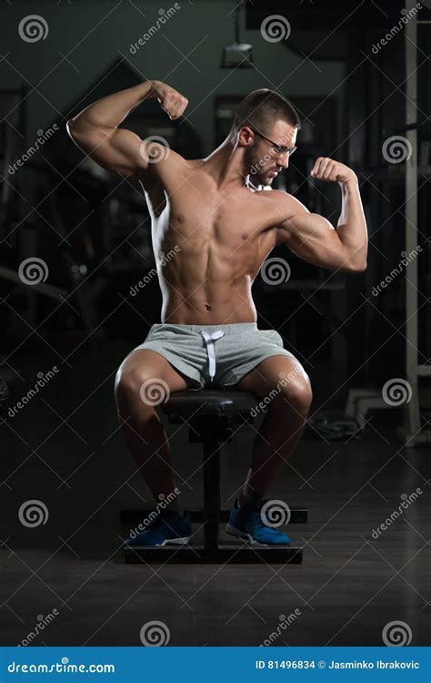 Nerd Man Sitting Strong In Gym Stock Photo Image Of Male Muscles