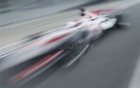 Motion Blur Of Sports Car At Motorsports Championship Race Stock Image