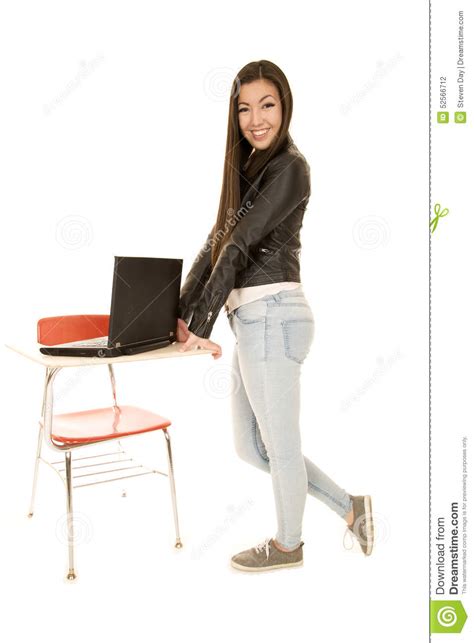 Standing desks encourage movement and make you more productive. Cute Young Woman Standing By Desk With Computer Stock ...