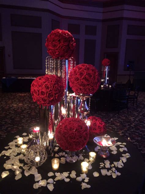 Red Rose Ball On Silver Vases With Lots Of Candles Wedding Table