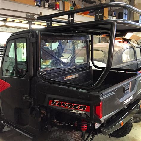 ROLL CAGE, ROOF AND SAFARI RACK INSTALLED ON A POLARIS RANGER 900XP