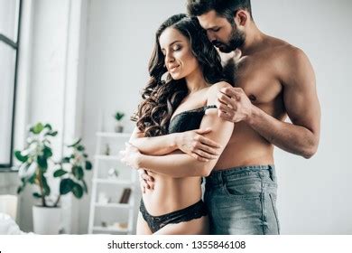 Handsome Shirtless Man Undressing Sexy Girlfriend
