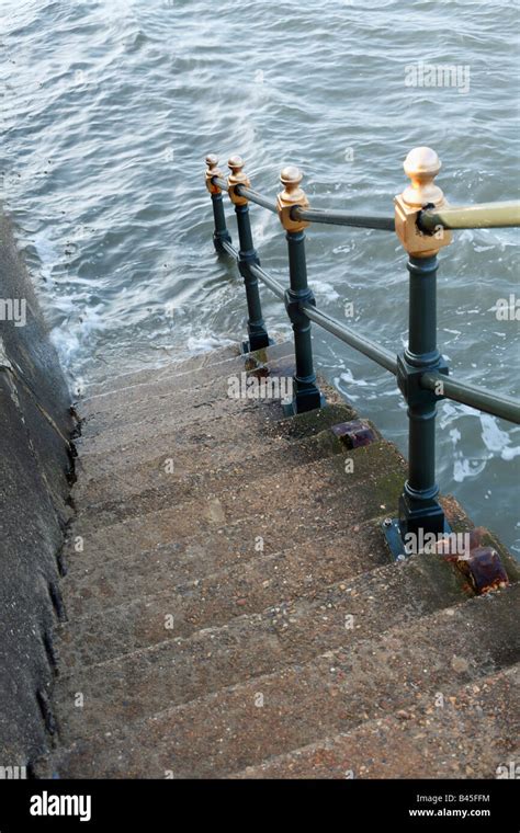 Steps And Railing Leading Down Into The Sea Stock Photo Alamy
