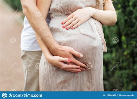 Man Hands Hug Pregnant Woman By Belly Closeup Photography Staying Beautiful Pregnancy Girl