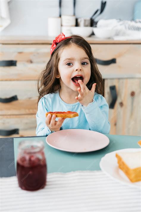 Free Photo Little Girl Having Her Breakfast