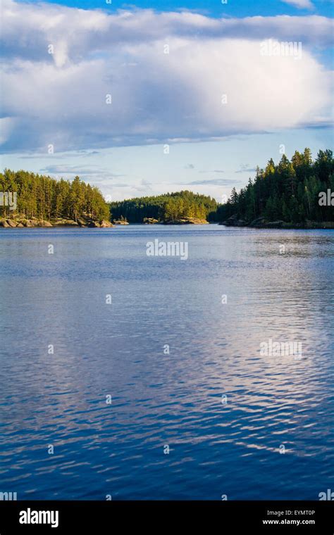 Lake Summer View With Reflection Of Clouds On Water Surface Finland