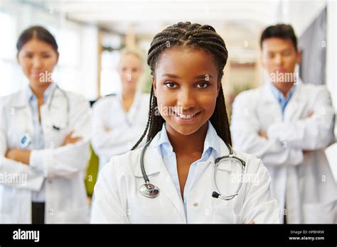 Young African Nurse In Medical Apprenticeship Smiling Friendly Stock