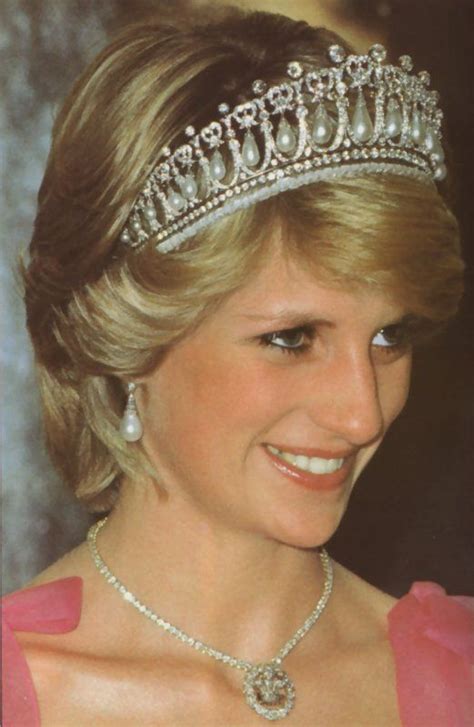 The Princess Is Wearing A Tiara With Pearls And Diamonds On Its Head