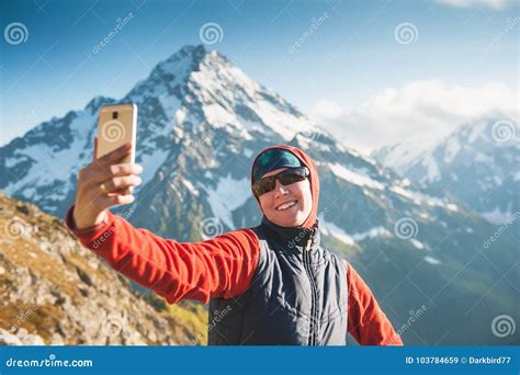 Happy Woman Hiker On The Top Of Mountain Making Selfie Stock Image